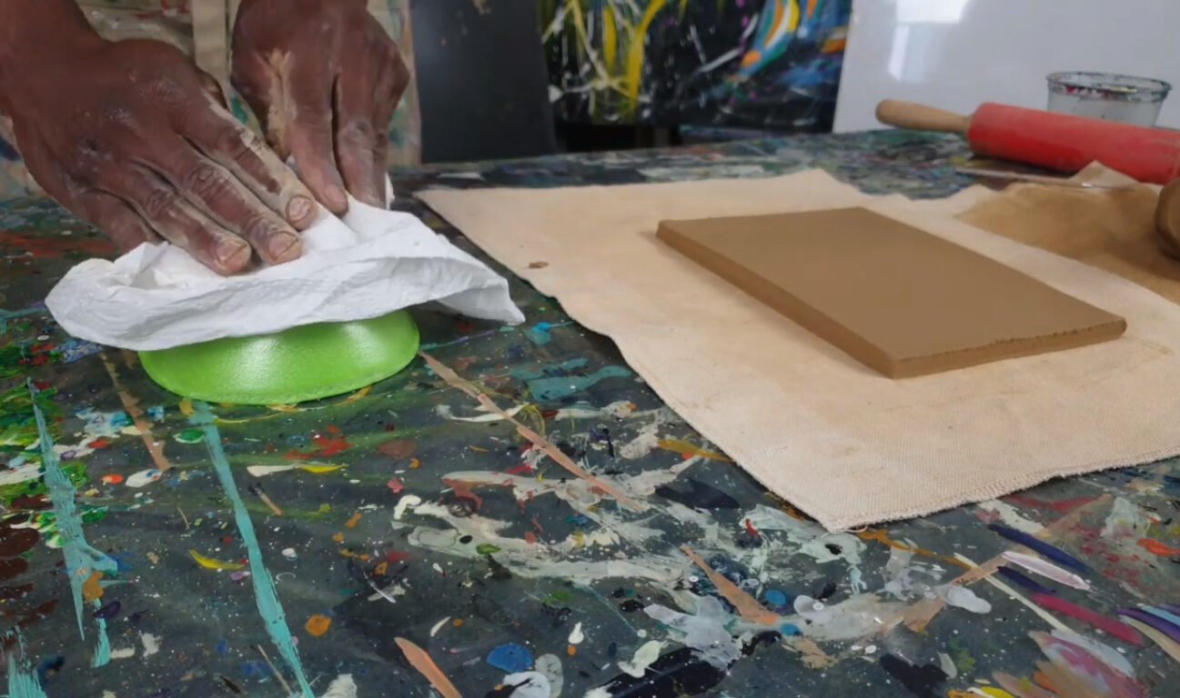 Using air-dry clay to make an African mask, using a mold to create the shape