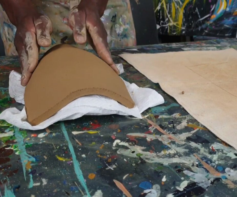 Air-dry clay African Mask, placing your clay slab over the mold